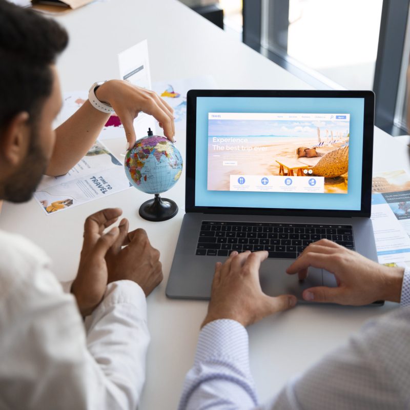 high-angle-man-working-travel-agency