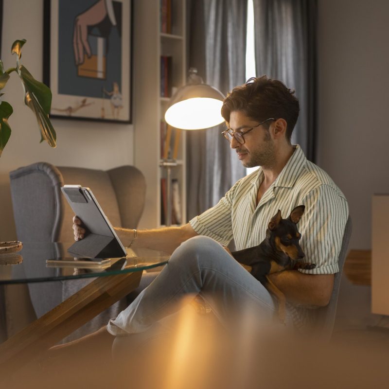 person-working-from-home-with-pet-dog